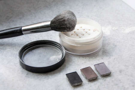 Face powder and brush on white backgroundの写真素材