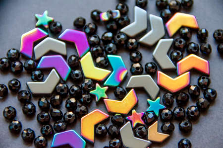 Colorful, black beads and stones isolated on white and grey backgroundの写真素材