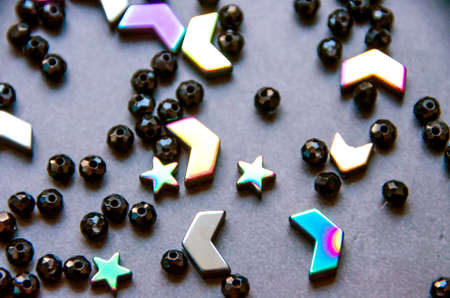 Colorful, black beads and stones isolated on white and grey backgroundの写真素材