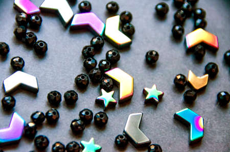 Colorful, black beads and stones isolated on white and grey backgroundの写真素材