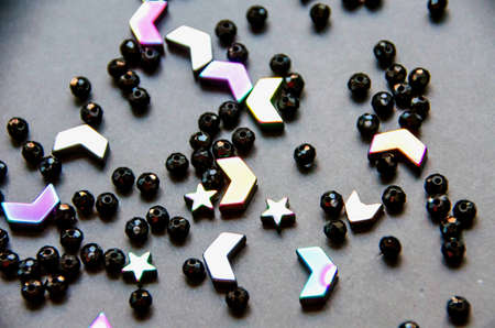 Colorful, black beads and stones isolated on white and grey backgroundの写真素材