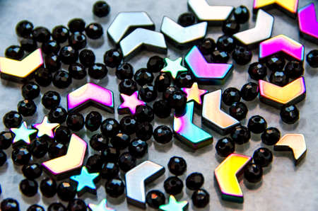 Colorful, black beads and stones isolated on white and grey backgroundの写真素材