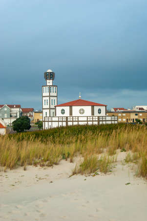 Igreja Matriz of Costa Nova among the beach dunes before the storm - Costa Nova, Portugalの写真素材