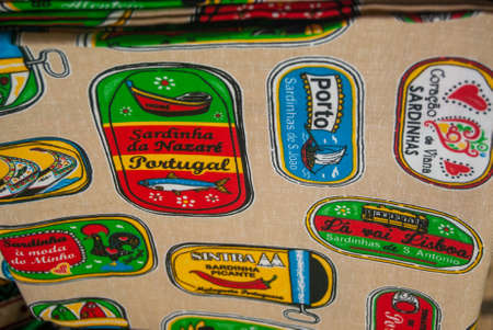 Aveiro, Portugal - June 11, 2021: Souvenir towel with colorful images of typical sardines Text Names of Portuguese Sardines Companies popular souvenir from Portugalのeditorial素材