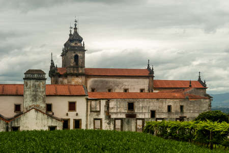 Side view of Monastery of Tibaes and gardens on a cloudy day, popular religious place of Minho region - Braga, Portugalの写真素材