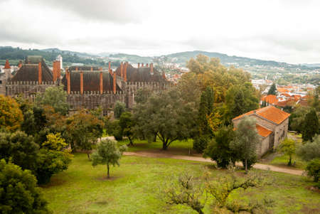 Aerial view of the Palace ancient church and a meadow, autumnal colorful green and yellow forest and...