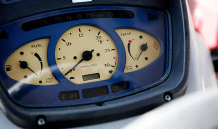 Modern tractor dashboard: speedometer, fuel level, engine temperature.の写真素材