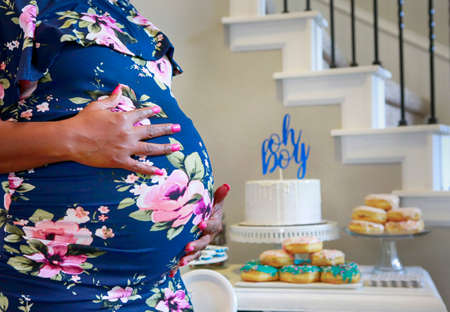 Conceptual close up photo of Pregnant African American woman celebrating baby shower partyの写真素材