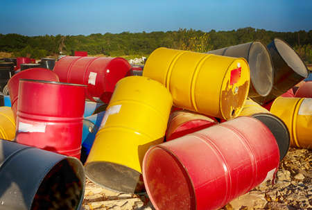 Junk yard, industrial metal recycling, colorful barrels.の写真素材