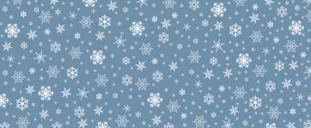Light blue winter background with snowflakes with space for text or imageの写真素材