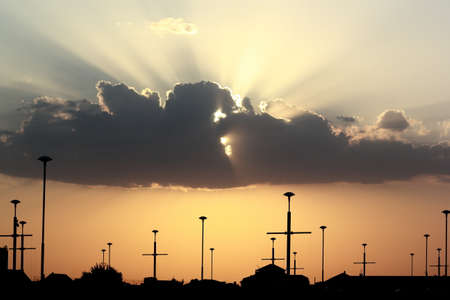 a large cloud on the background of the sunsetの写真素材