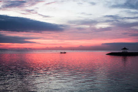 Pink sunrise on Sanur beach, Baliの写真素材