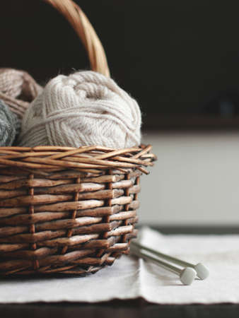 Wool in basket with needlesの写真素材