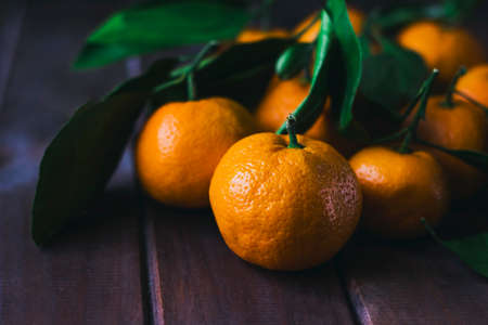 Fresh tangerines on wooden background. Close upの写真素材