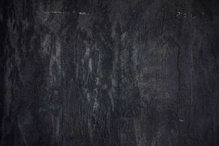 The stone wall concrete textured black backgroundの写真素材
