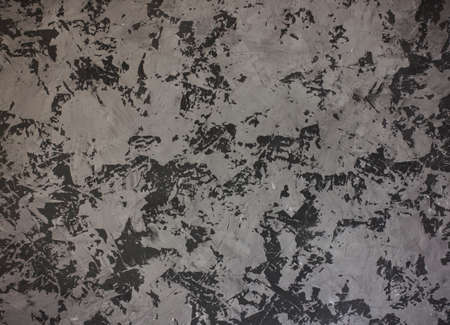 Dark grey concrete textured painted background