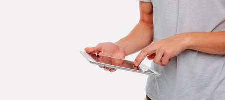 Tablet in men's hands on a white background, banner