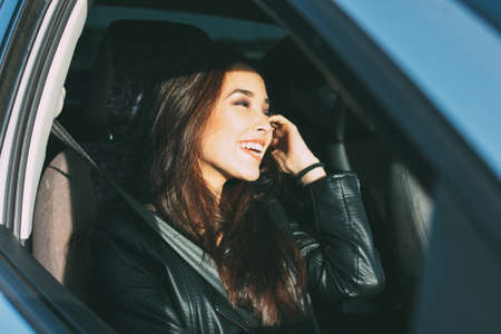 Happpy beautiful charming brunette long hair young asian woman in black leather jacket enjoing life...