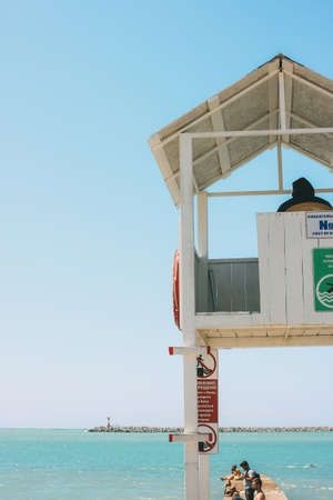 Sochi, Russia - August, 05, 2019. White booth tower with lifeguard on the shore of Black seaのeditorial素材