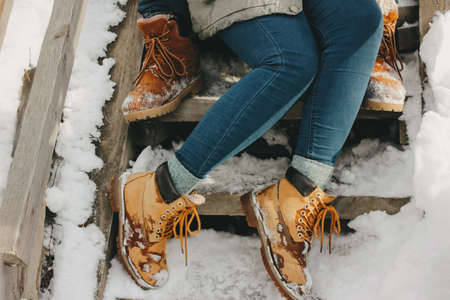 The crop photo of young couple at the nature park in the cold season. Travel adventure love storyの写真素材