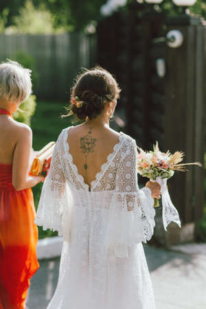The happy bride and her best friend at the wedding party, bridesmaidsの写真素材