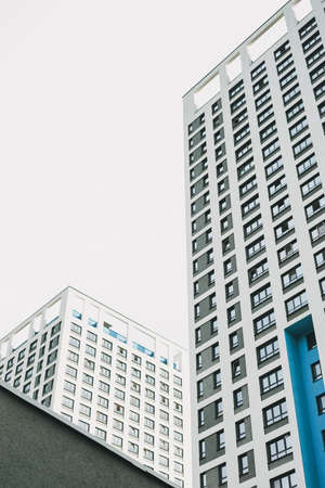 Typical modern multi storey residential skyscraper building on sky backgroundの写真素材