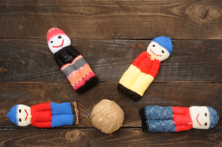 Pupae associated with the remains of woolen threads on the background of coarse rock-climbing and wooden boardsの写真素材