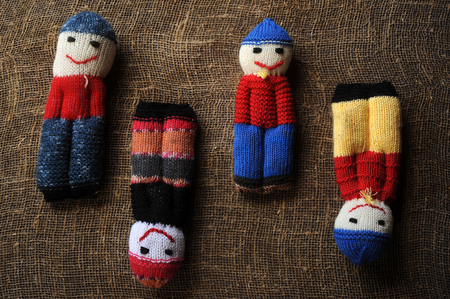 Pupae associated with the remains of woolen threads on the background of coarse rock-climbing and wooden boardsの写真素材