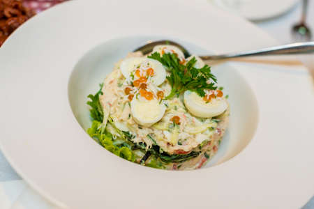 Salad with quail eggs, greens and red caviar.の写真素材