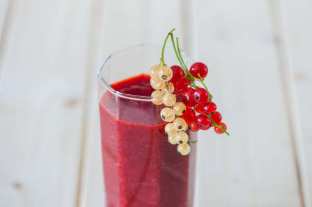 Smoothies of strawberries and currants in a high keyの写真素材