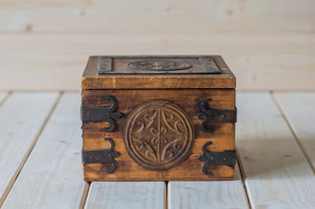 Old wooden chest on a wooden backgroundの写真素材