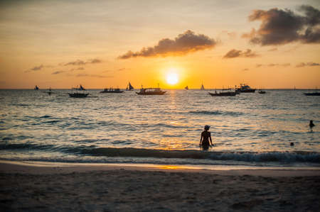 Sunset in Boracay, boat, girl White beachの写真素材