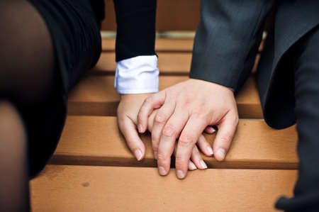 Office workers hold hands and love in the office