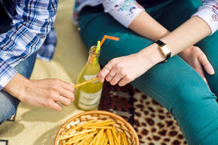 A man and a woman pulled a hand of crackers, the concept of loveの写真素材