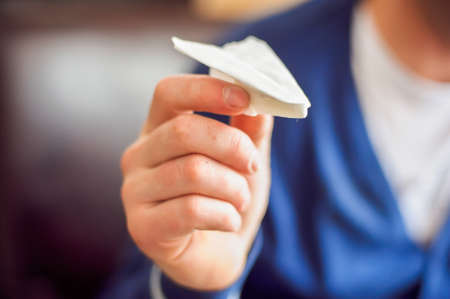 A man starts a plane from napkinsの写真素材