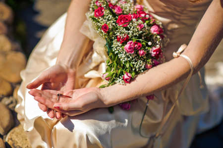 Dragonfly in the hand of a young womanの写真素材