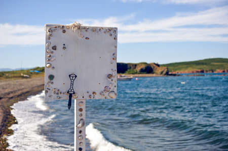 Plate with shells on the sea for textの写真素材