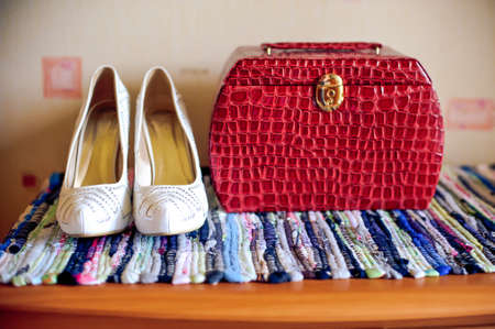 White shoes and Red handbag on the chest