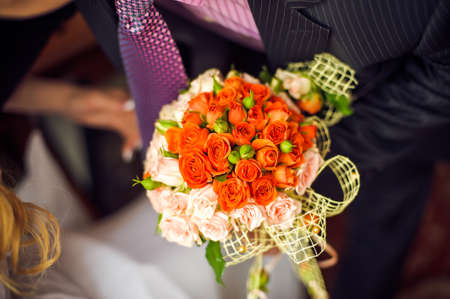 Bouquet of pink and orange flowers, small rosesの写真素材