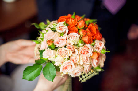 Bouquet of pink and orange flowers, small rosesの写真素材
