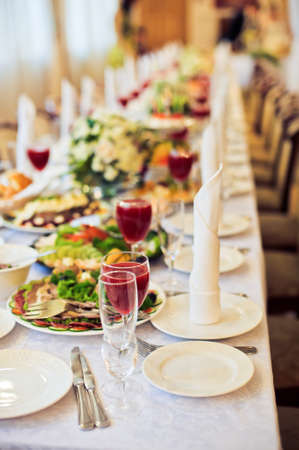Catering service. Restaurant table with food. Huge amount of food on the table. Plates of food. Dinner time, lunch.の写真素材