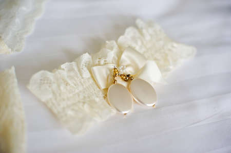 Lace garter bride ivory color and earringsの写真素材