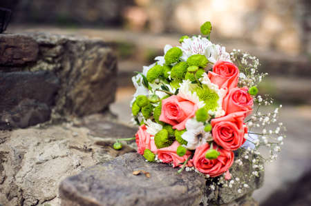 White Pink Bouquet on a brick wallの写真素材