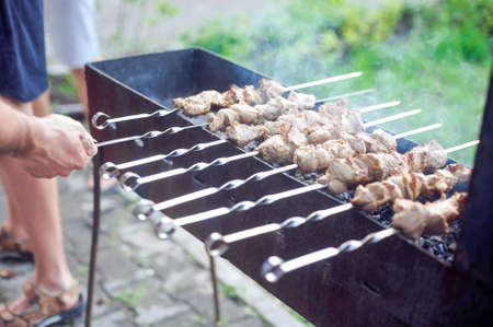 Kebabs outdoors. Barbecue, fried meat on the fireの写真素材