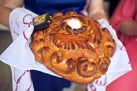 Bread-and-salt welcome. A traditional ritual of offering bread and salt to a welcome guest.の写真素材