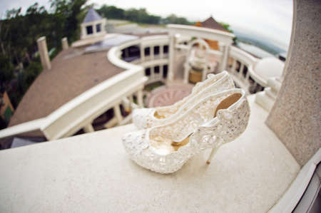 Wedding shoes cream color on the windowsillの写真素材