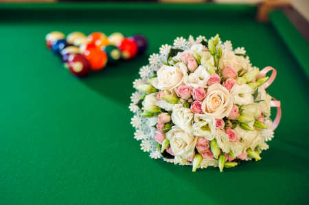 Bridal bouquet on a billiard table greenの写真素材