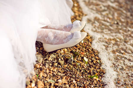 Bride's shoes on the seashore Wedding conceptの写真素材
