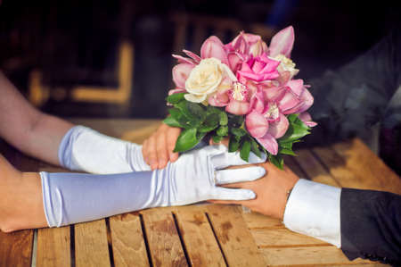 Hands of the groom and the bride with wedding rings. Wedding conceptの写真素材