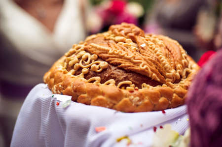 Bread-and-salt welcome. A traditional ritual of offering bread and salt to a welcome guest.の写真素材